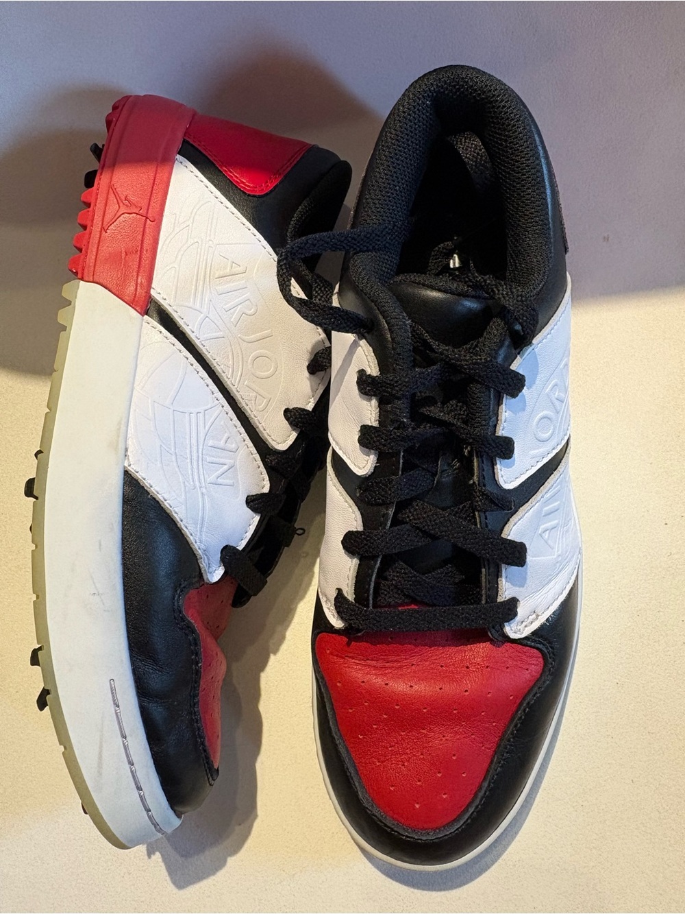 Unisex Jordan NU Retro Low G Spiked Golf Shoe in Black, White & Red